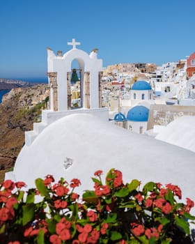 sunset by the ocean of Oia Santorini Greece, a traditional Greek village in Santorini with whitewashed churches and blue domes