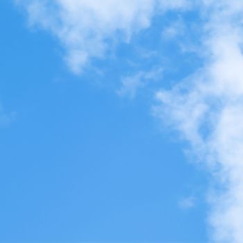 Background of blue sky with white clouds. Natural backdrop