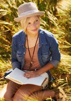 Fascinated by nature. an attractive young woman outdoors on a summer day