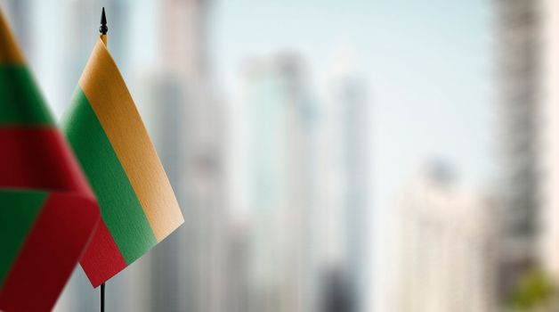 A small Lithuania flag on an abstract blurry background.