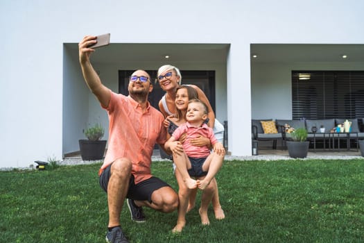 Happy caucasian family of four, mother father and children at home, outdoors playing on the grass, and indoors in the living room having fun as a family.