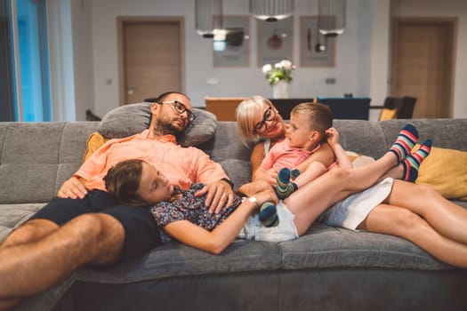 Happy caucasian family of four, mother father and children at home, outdoors playing on the grass, and indoors in the living room having fun as a family.