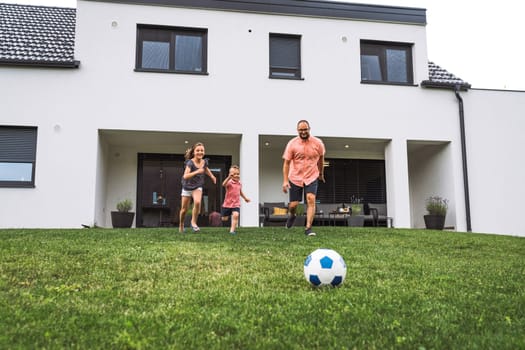 Happy caucasian family of four, mother father and children at home, outdoors playing on the grass, and indoors in the living room having fun as a family.