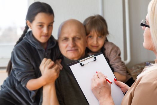 Senior man with social worker.