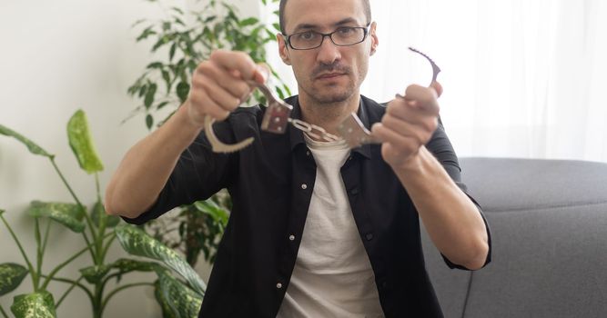 Portrait of a Caucasian man with handcuffs.