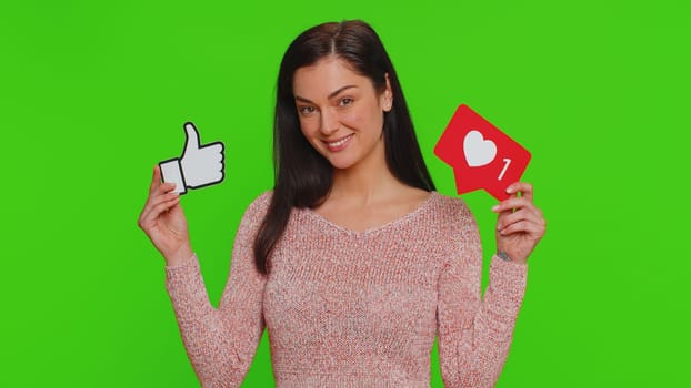 Like. Lovely woman raises inscription thumbs up banner thumbs up agrees with something, gives positive reply recommends advertisement likes good on social media. Young girl on chroma key background