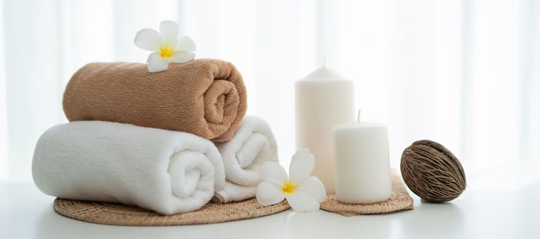 Spa accessory composition set in day spa hotel , beauty wellness center . Spa product are placed in luxury spa resort room , ready for massage therapy from professional service .