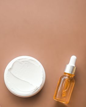 Beauty cosmetics and skincare product on beige background, flatlay.