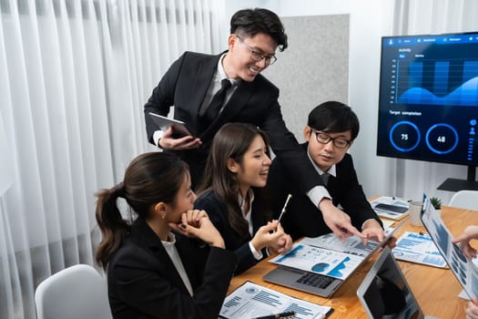 Business team of financial data analysis meeting with business intelligence, report paper and dashboard on laptop for marketing strategy. Business people working together to promote harmony in office.