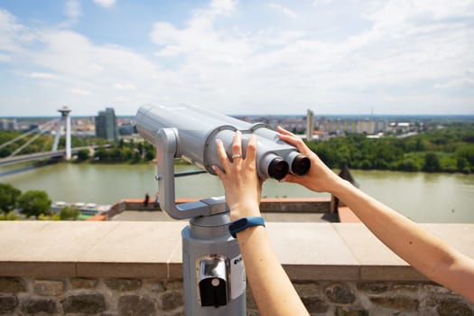 Girl on the observation deck, view of the city. Bratislava castle