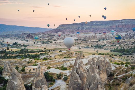 Colorful hot air balloon flying over Cappadocia, Turkey.