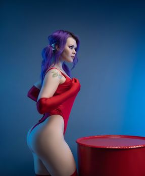 the sexy girl in red bodysuit stockings shows off her big buttocks