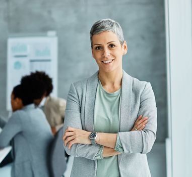 Portrait of a group of young business people having a meeting in the office. Teamwork and success concept, portrait of a smart young businesswoman