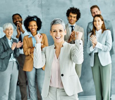 Portrait of a group of young business people having a meeting in the office. Teamwork and success concept