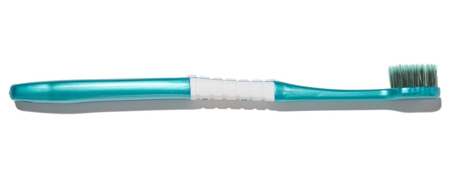 Plastic toothbrush on a white isolated background