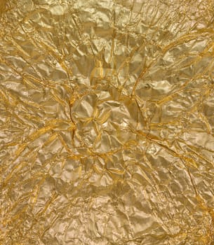 Crumpled golden foil texture, full frame