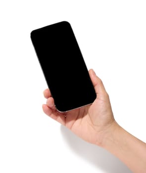 A woman's hand holds a smartphone with a blank black screen on a white isolated background