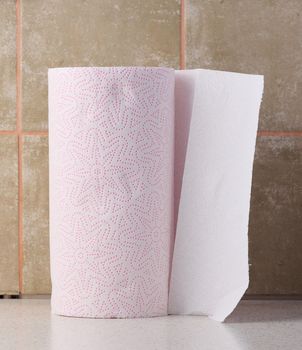 Soft white paper towel on a white table, disposable kitchen towel
