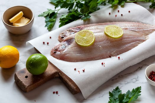 cooking the sole fish french cuisine meuniere style with parsley, butter and lemon sauce