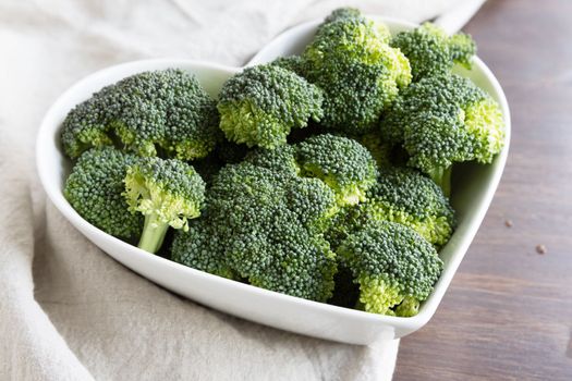 Healthy fresh broccoli in a heart shaped bowl