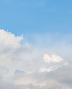 Background of blue sky with white clouds. Natural backdrop