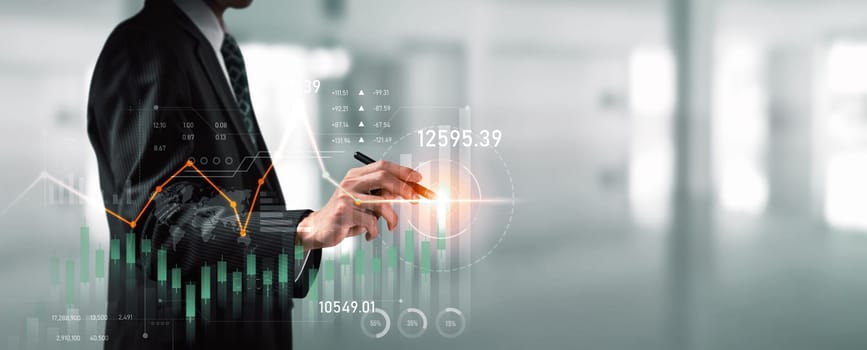 Businessman analyst working with digital finance business data graph showing technology of investment strategy for perceptive financial business decision. Digital economic analysis technology concept.