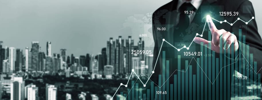 Businessman analyst working with digital finance business data graph showing technology of investment strategy for perceptive financial business decision. Digital economic analysis technology concept.