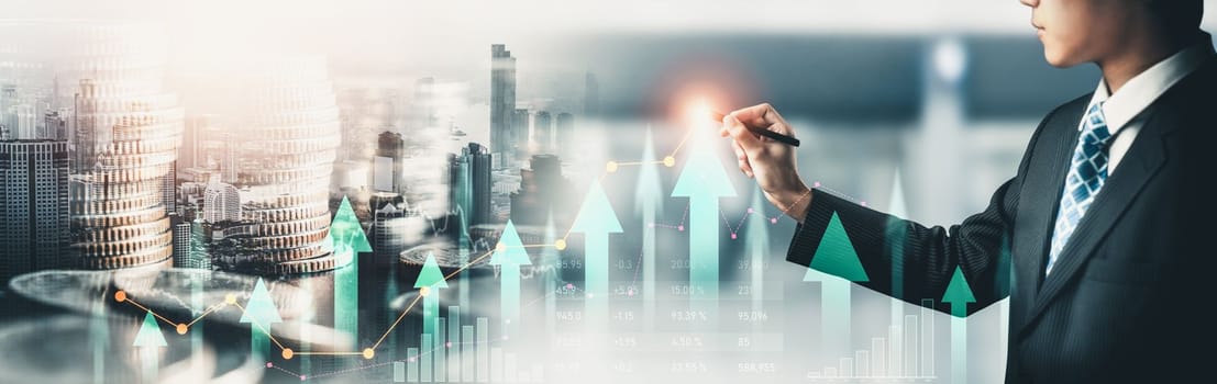 Businessman analyst working with digital finance business data graph showing technology of investment strategy for perceptive financial business decision. Digital economic analysis technology concept.