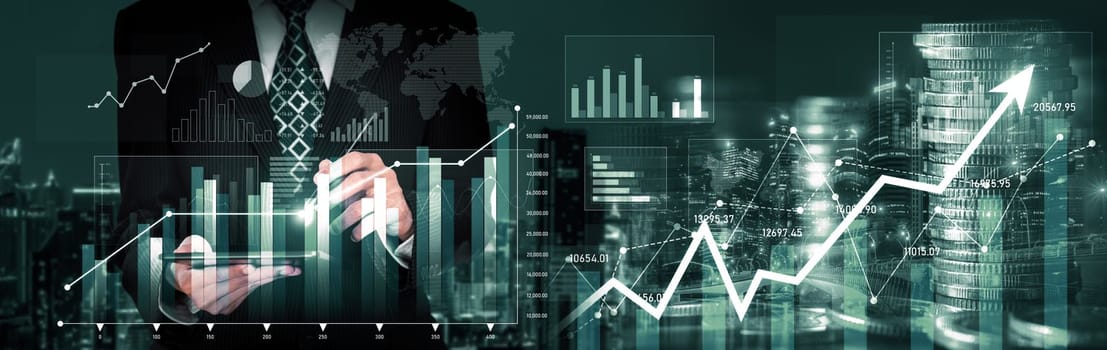 Businessman analyst working with digital finance business data graph showing technology of investment strategy for perceptive financial business decision. Digital economic analysis technology concept.