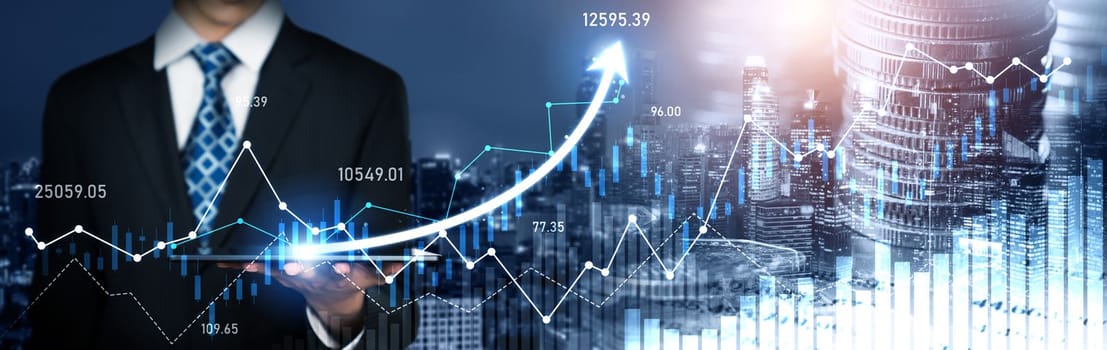 Businessman analyst working with digital finance business data graph showing technology of investment strategy for perceptive financial business decision. Digital economic analysis technology concept.