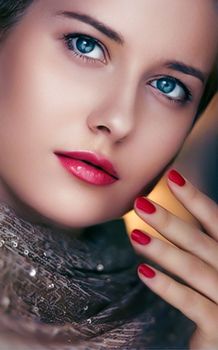 Beauty, makeup and glamour, face portrait of beautiful woman with manicure and red lipstick make-up wearing gold for luxury cosmetics, style and fashion look