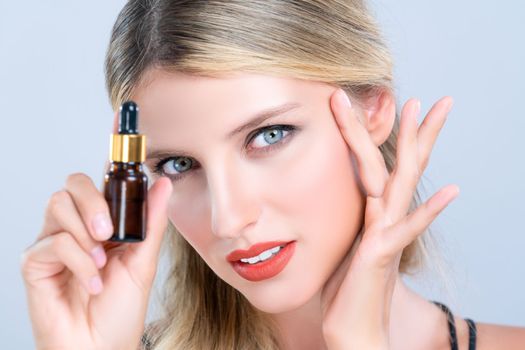 Closeup alluring portrait of beautiful woman in isolated holding extracted cannabis oil bottle for skincare product. Cannabis and CBD oil pipette for facial treatment cosmetology and beauty concept.