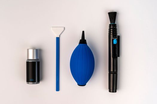 a set for cleaning the chamber from dirt. a purge bag, a mop for cleaning the matrix, a cleaning liquid. white background