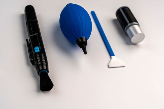 a set for cleaning the chamber from dirt. a purge bag, a mop for cleaning the matrix, a cleaning liquid. white background