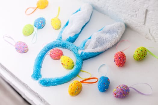 Colorful Easter eggs with hand drawn bunny ears. Funny Easter concept