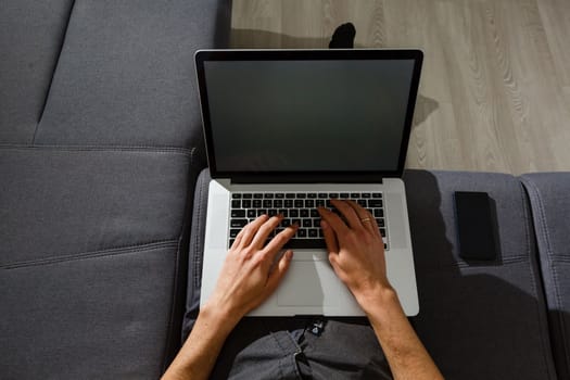 elegant business multitasking multimedia man using devices at home