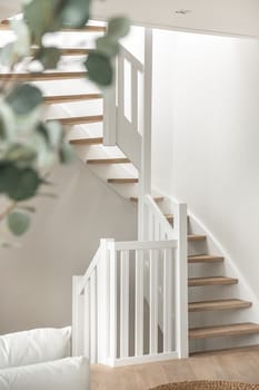 Designed in a minimalistic style staircase. Interior shot of luxury house stairs