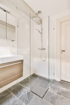 a bathroom with a sink, mirror and shower head mounted on the wall next to the bathtub that's attached to the