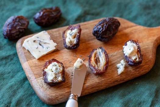 date fruits stuffed with gorgonzola cheese, side view