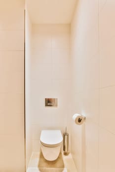 a toilet in the corner of a small bathroom with white tiles on the walls, and a mirror above it