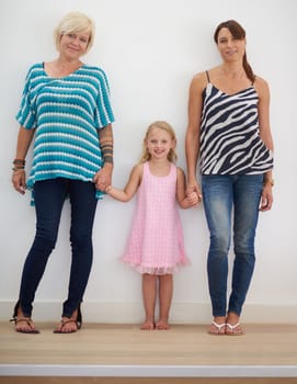 Family is life. a lesbian couple at home with their daughter