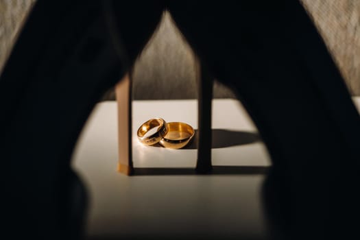 Close-up of two gold wedding rings for a wedding.