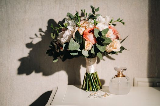 wedding bouquet with roses on the table.The decor at the wedding.