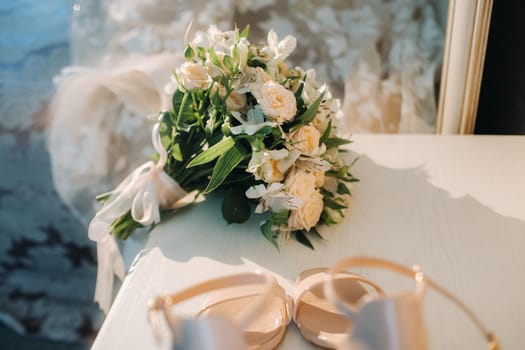 wedding bouquet with roses on the table.The decor at the wedding.