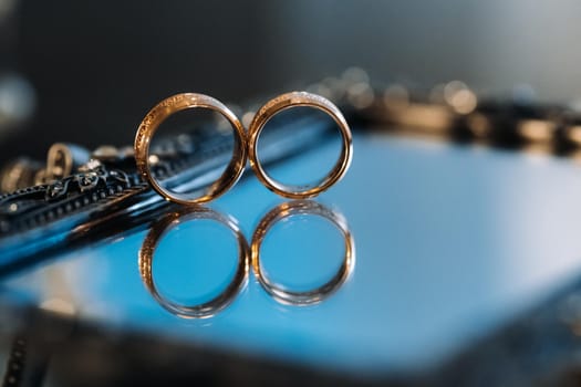 Close-up of two gold wedding rings for a wedding.