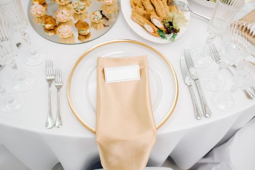 Dishes on the wedding table, decor of the dining table for the holiday.