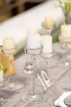 wedding table decoration with flowers on the table in the castle, table decor for dinner by candlelight.Dinner with candles.