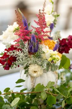 wedding table decoration with flowers on the table in the castle, table decor for dinner by candlelight.Dinner with candles.