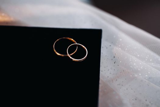 Close-up of two gold wedding rings for a wedding.