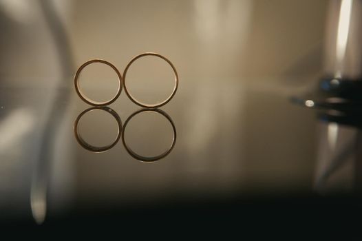 Close-up of two gold wedding rings for a wedding.